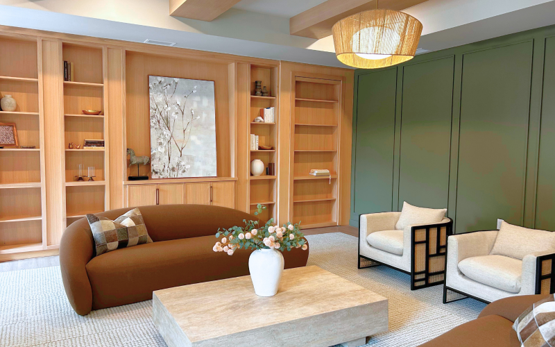 Bright community bar room with a bar and chairs perfect for hosting events flooded with natural light