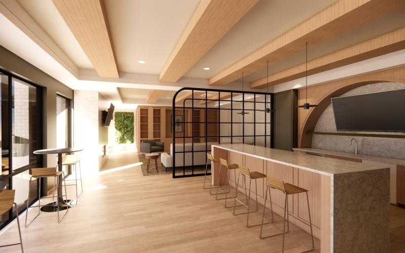 a sparkling community bar room with a bar and chairs perfect for hosting events